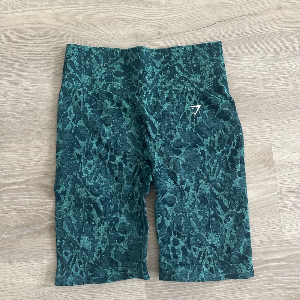 GymShark teal printed biker shirts in size medium.